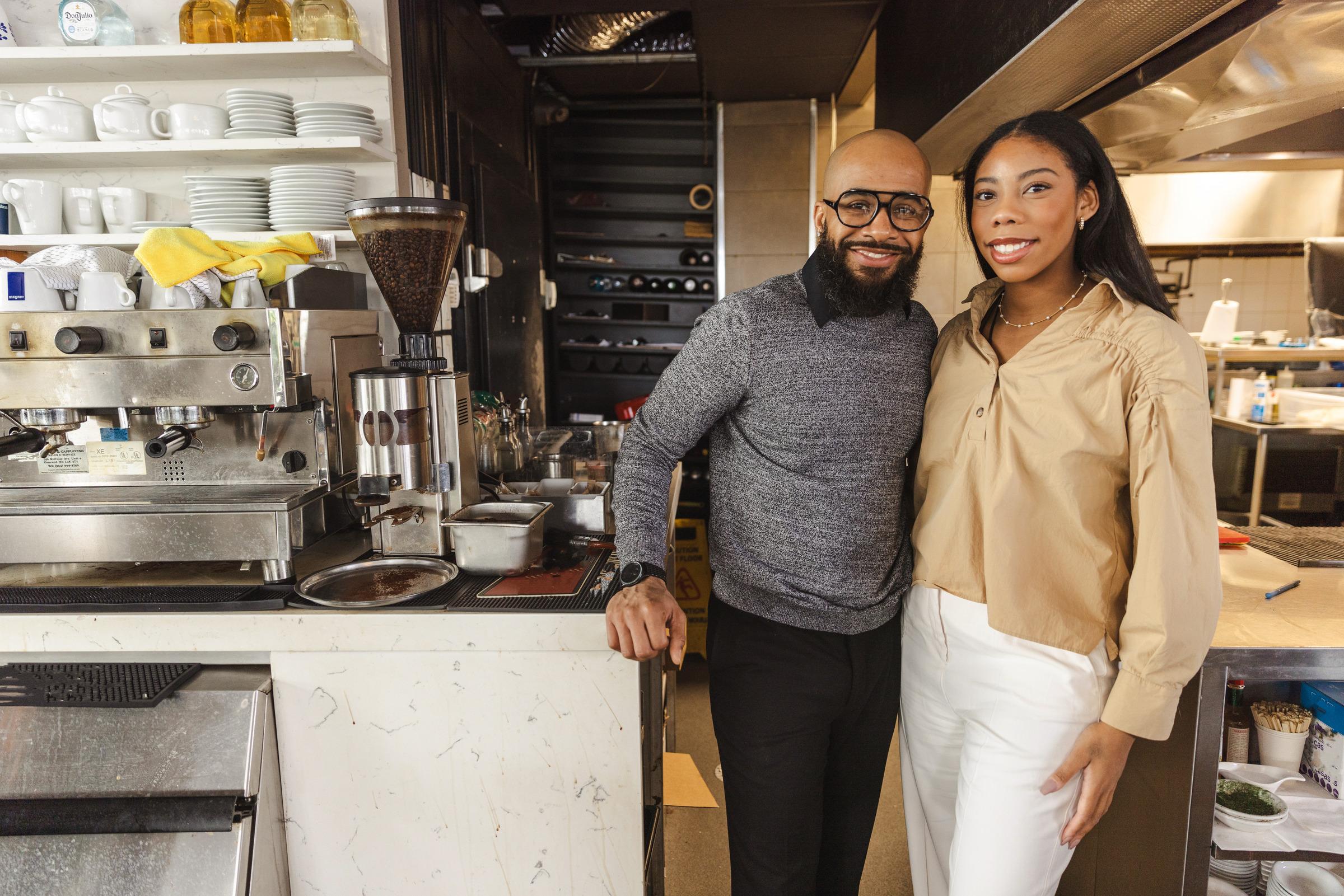 Two business partners in their restaurant kitchen