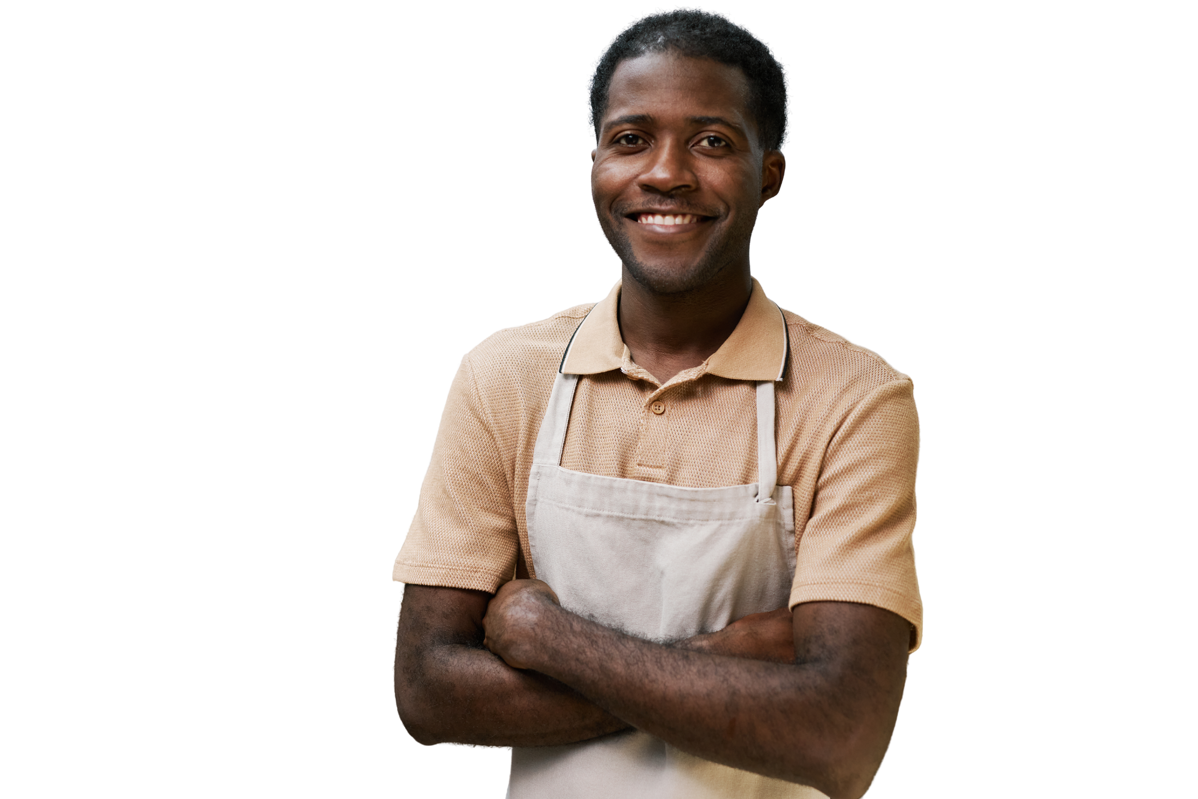 A young Caribbean baker in his apron, arms crossed